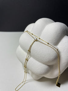 Handkette aus goldplattiertem Edelstahl mit Zirkonia